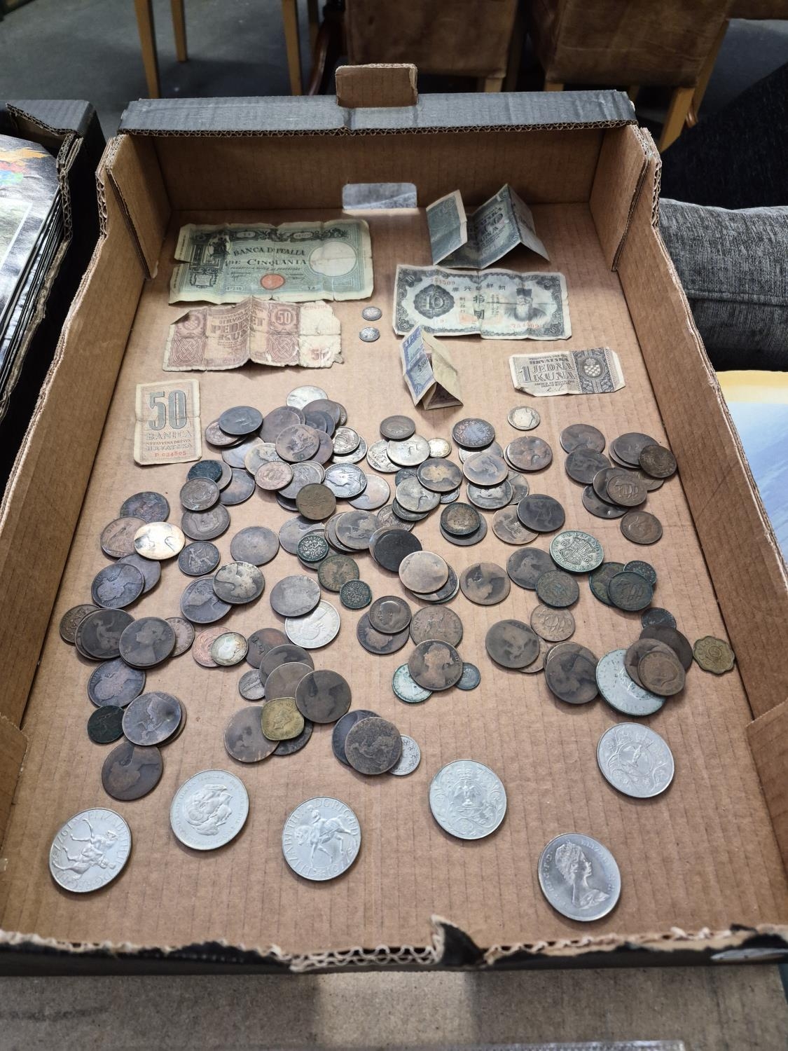 Box containing assorted collectible coins and foreign bank notes