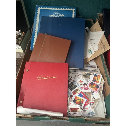 787 - Box containing stamp albums with contents and assorted stamps on paper