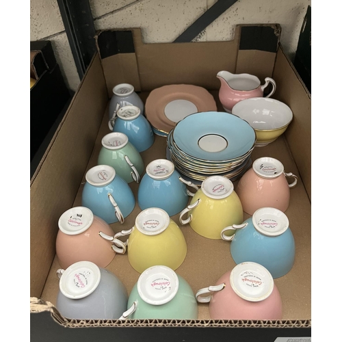 112 - Box containing multi-coloured Colclough cups & saucers