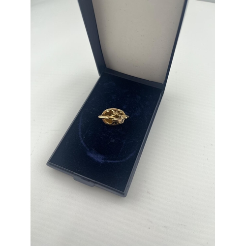 33 - 9ct Gold Albert charm featuring a tiger's eye, 5.5g - Only 10% buyer's premium