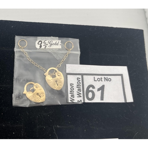 61 - 2 9ct Gold heart padlock clasps including safety chain, 1.2g - Only 10% buyer's premium