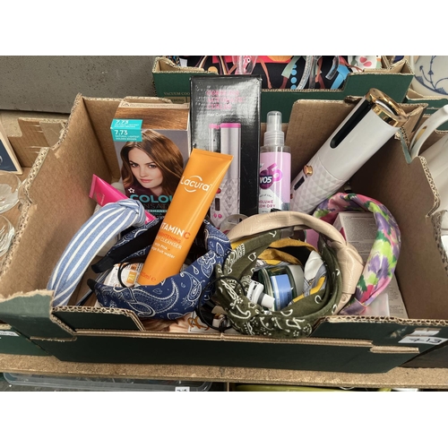713 - Box containing assorted cosmetics and an automatic cordless hair curler