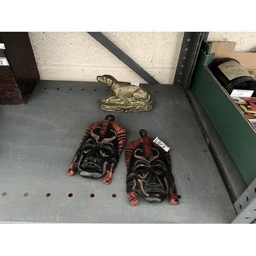 73 - Brass fire side dog and a pair of Kenyan tribal masks