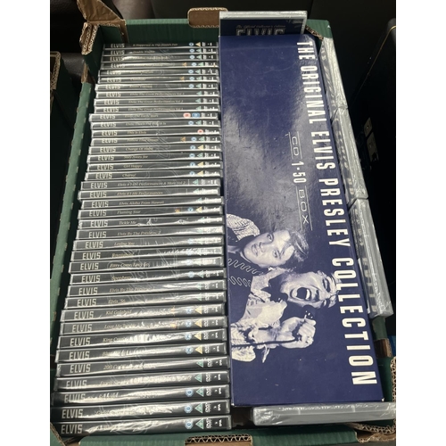 740 - Box containing the original Elvis Presley CD collection 1-50 and a quantity of sealed DVDs