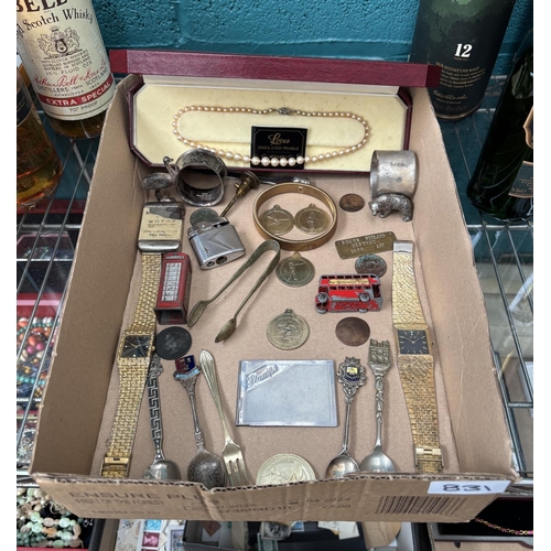 831 - Box containing curios including collector's spoons, coins and an emu napkin ring etc