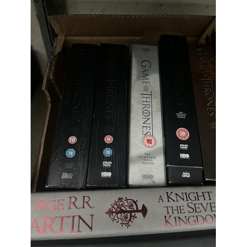 113 - Box containing George R.R. Martin books and Game Of Thrones DVD box sets etc