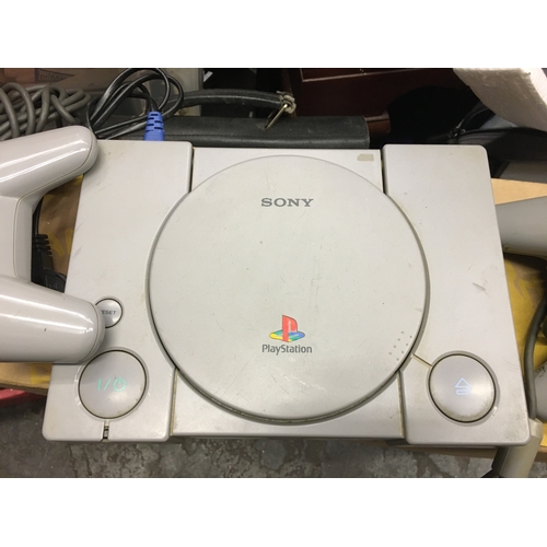 396 - PLAYSTATION WITH TWO CONTROLLERS MAINS POWERS ON AND WORKING