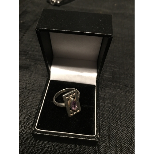 292 - LOVELY LARGE SILVER 925 PURPLE STONE RING SET IN CELTIC STYLE