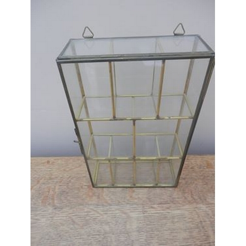 329 - Brass and glass display case with wall hanging attachments and closing bar. 23 x 15 cm