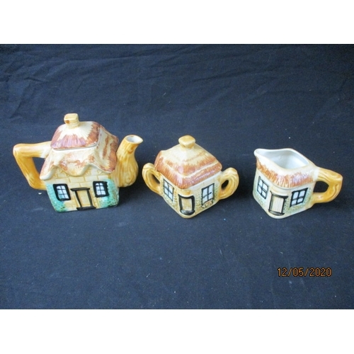 172 - LOVELY Trio of cottage style teapot, sugar bowl and milk jug. (l)