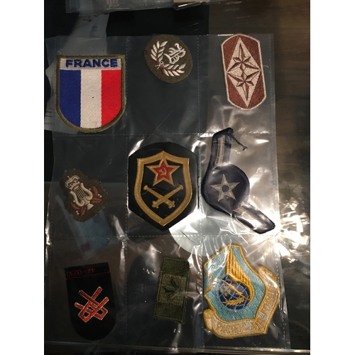 314 - SLEEVE OF 9 MILITARY CLOTH BADGES