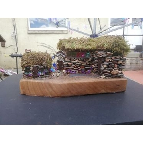 340 - Handmade pebble building with natural dried moss roof and hardwood base  (AR)