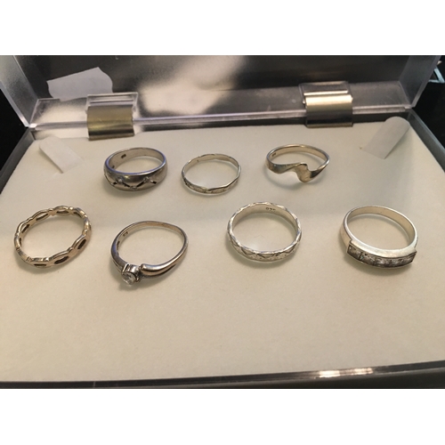 100F - SELECTION OF SEVEN SILVER RINGS