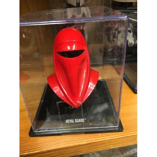 428 - CRACKING MINIATURE ROYAL GUARD HELMET IN PLASTIC DISPLAY BOX