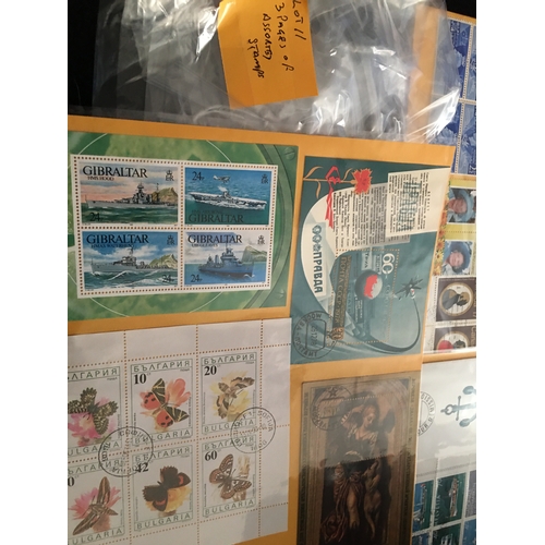 135 - THREE PAGES OF ASSORTED STAMPS

L11