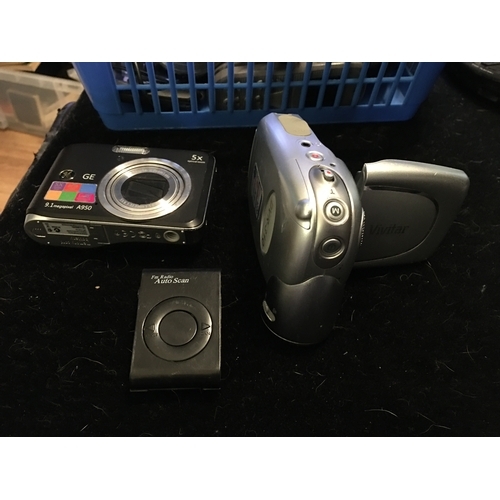 104 - TWO DIGITAL CAMERAS AND AN FM RADIO WITH AUTO SCANNER