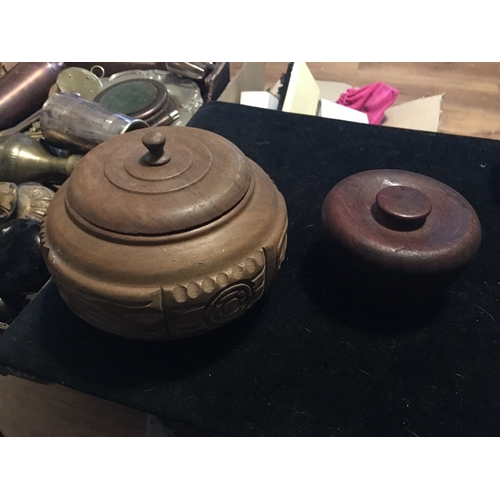 69 - TWO LOVELY LIDDED WOODEN POTS INCLUDING HEAVY CARBED AND TREEN