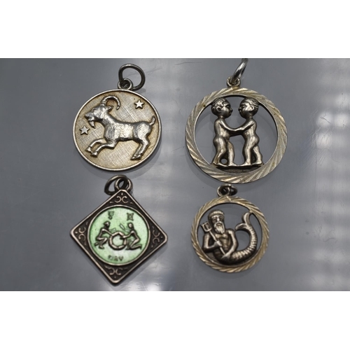 65 - LOVELY Selection of 4 Zodiac Silver Pendants