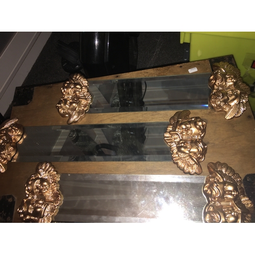 54 - LOVELY NEW SET OF THREE GRADUATED GLASS SHELVES WITH GILT CHERUBS AT EITHER END