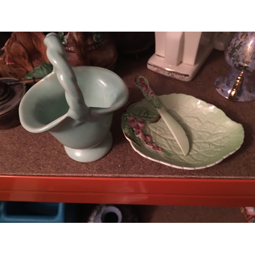 200D - A CARLTON WARE BUTTER DISH WITH MATCHING KNIFE AND A RARE GERMAN BASKET VASE IN POWDER BLUE