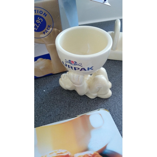 419 - FOUR PIECE LURPAK COLLECTION INCLUDING TOAST RACK, BUTTER DISH AND TWO BOXED EGG CUPS