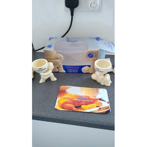 419 - FOUR PIECE LURPAK COLLECTION INCLUDING TOAST RACK, BUTTER DISH AND TWO BOXED EGG CUPS