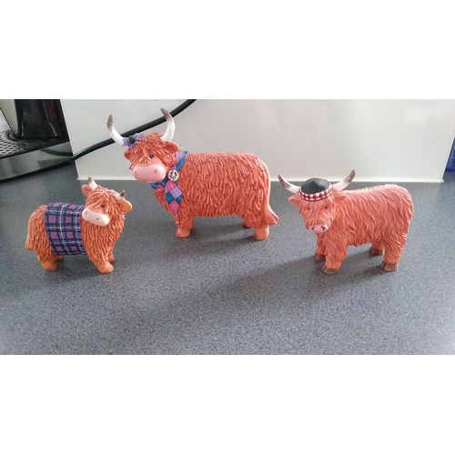 358 - THREE SCOTTISH COW ORNAMENTS