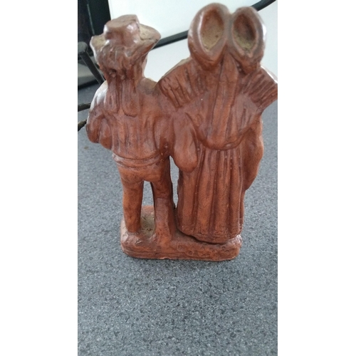 380 - UNUSUAL PIPER AND HIS WIFE? FIGURINE