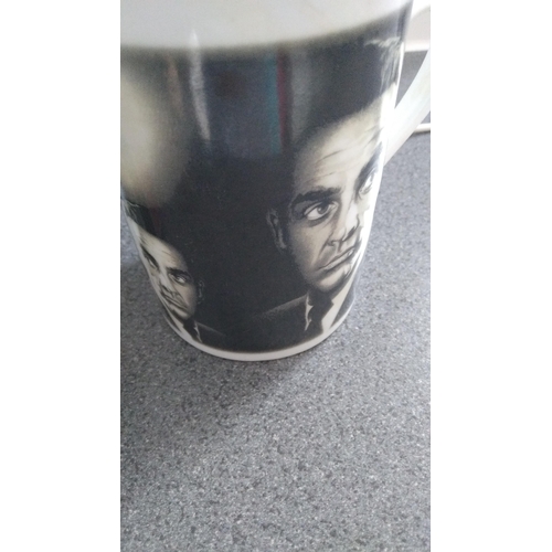 389 - TWO SEAN CONNERY AS JAMES BOND MUGS