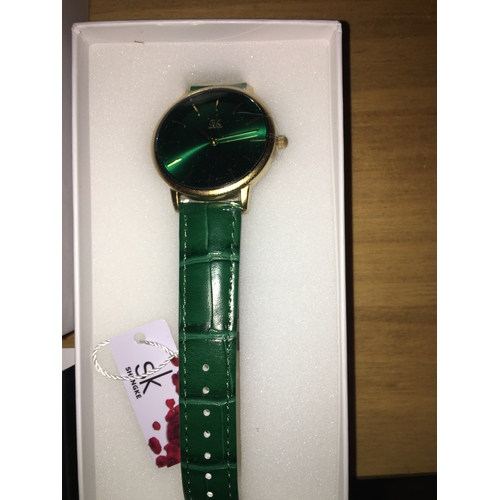 186 - NEW BOXED SHENJKI LADIES WATCH IN GREEN