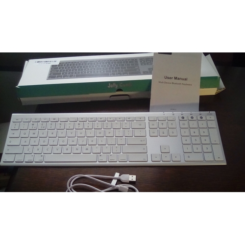 85 - NEW BOXED JELLY COMB DESK TOP KEYBOARD