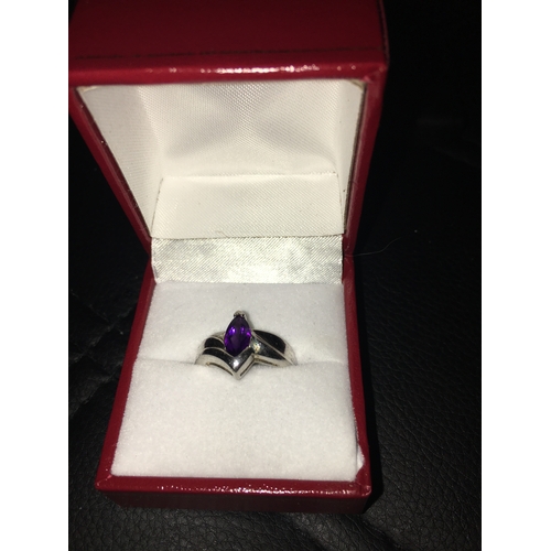 280M - A Lovely 925 Silver Ring With Purple Gem, Size k. in presentation box