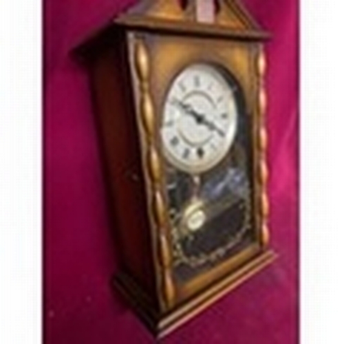 59 - VERY NICE Free standing or wall hanging 15 day clock measuring 20 x 40 cms tall with key