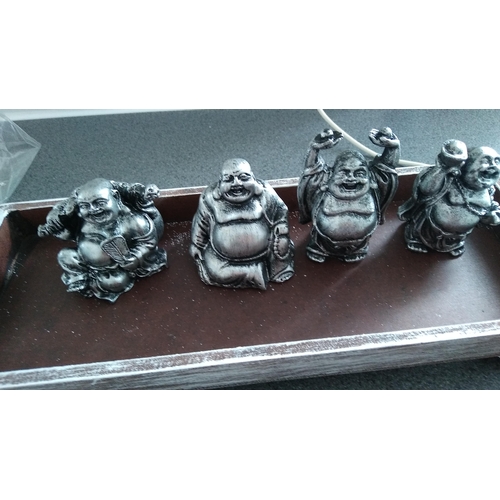 600 - SET OF FOUR BHUDAS ON PLINTH SAND GARDEN