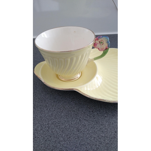 605 - LOVELY CROWN DEVON TENNIS CUP AND SAUCER