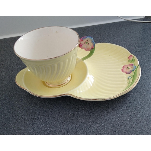 605 - LOVELY CROWN DEVON TENNIS CUP AND SAUCER