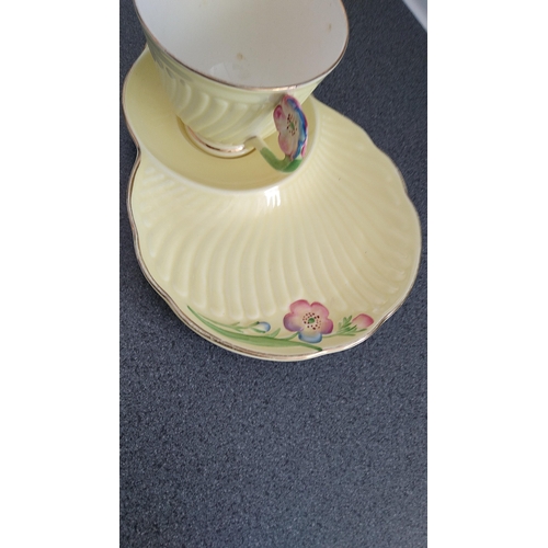 605 - LOVELY CROWN DEVON TENNIS CUP AND SAUCER