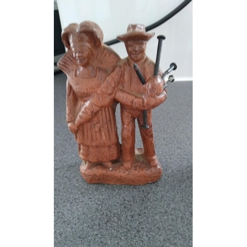 380 - UNUSUAL PIPER AND HIS WIFE? FIGURINE