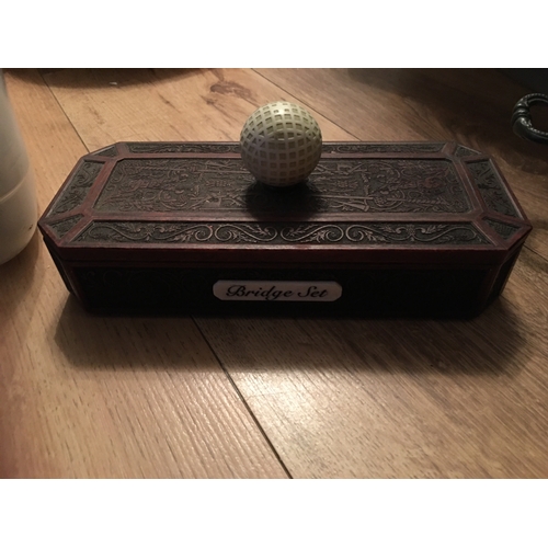 175 - A FANTASTIC BRIDGE SET IN GOLFING WOODEN BOX DECORATED WITH GOLFERS AND GOLF BALL HANDLE FULLY COMPL... 