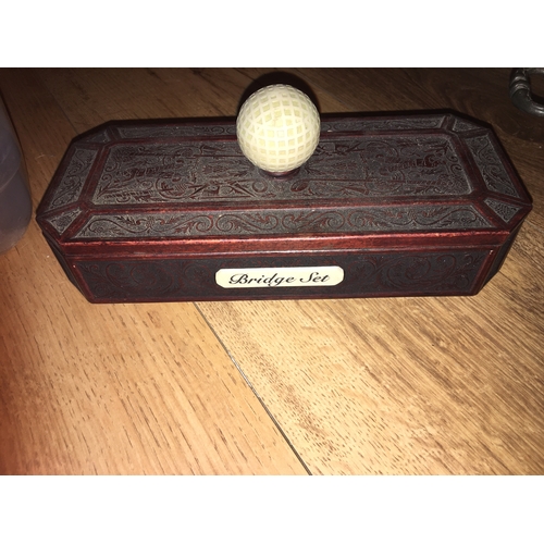 175 - A FANTASTIC BRIDGE SET IN GOLFING WOODEN BOX DECORATED WITH GOLFERS AND GOLF BALL HANDLE FULLY COMPL... 