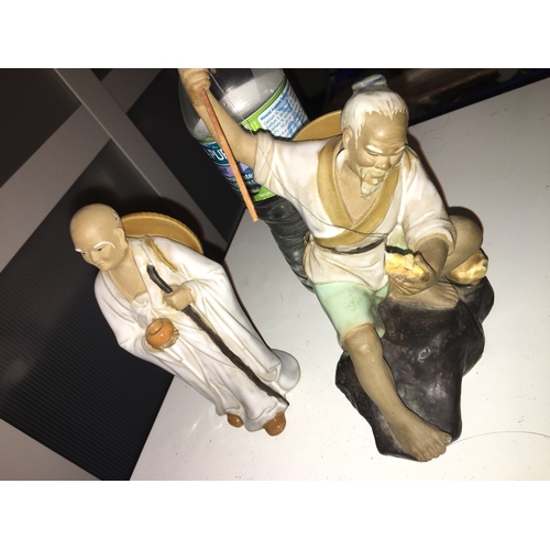 11 - TWO MUDMEN FIGURES