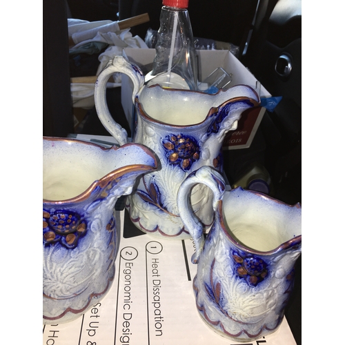 100D - LOVELY Graduated set of 3 Flow Blue Glazed Earthenware Pitchers