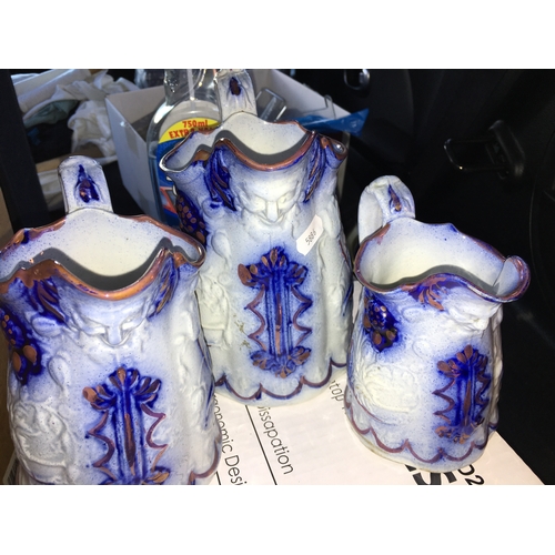 100D - LOVELY Graduated set of 3 Flow Blue Glazed Earthenware Pitchers