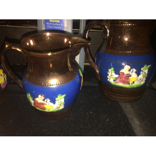 100E - Set of Three graduated Lustre Ware Jugs With Scenes and Birds