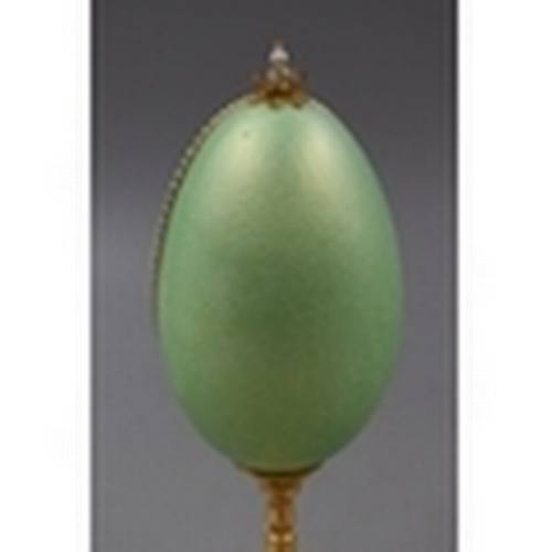 38 - Beautiful Rider and Smart Natural Egg Containing Jewel Tree Standing on Gold Plated Base