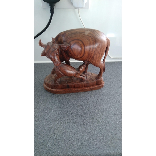 394 - WOODEN BULL AND CALF