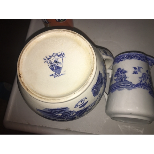 79 - TWO BLUE AND WHITE JUGS INCLUDING Large T & G MING handle with repair and DECO ORIENTAL SCENE UN MAR... 