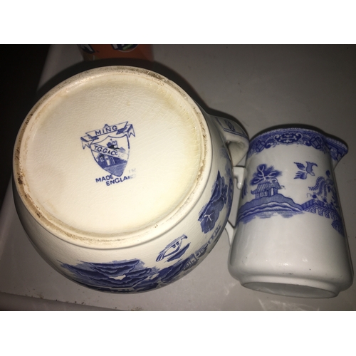 79 - TWO BLUE AND WHITE JUGS INCLUDING Large T & G MING handle with repair and DECO ORIENTAL SCENE UN MAR... 