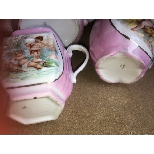 220 - LOVELY SELECTION OF PINK AND WHITE CHERUB DESIGNED JUGS BOWL AND TEA POT Slight nick to spout