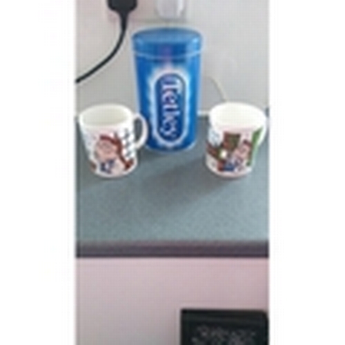 304 - TWO TETLEY MUGS AND KILN CRAFT CANNISTER